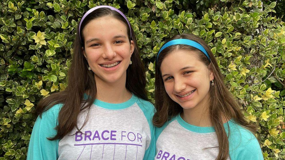Hadley and Delaney wearing Brace for Impact Ts